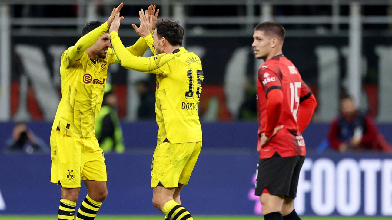 Dortmund reach cl last 16 with 3-1 win at milan0