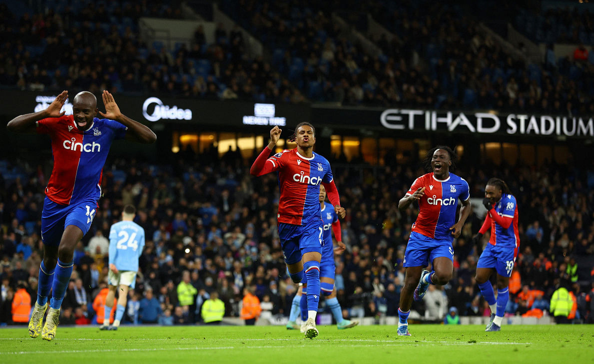Olise's late penalty rocks man city as palace hold champions0